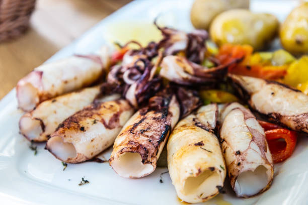 istock Mediterranean Octopus with vegetables and potatoes 1032489584