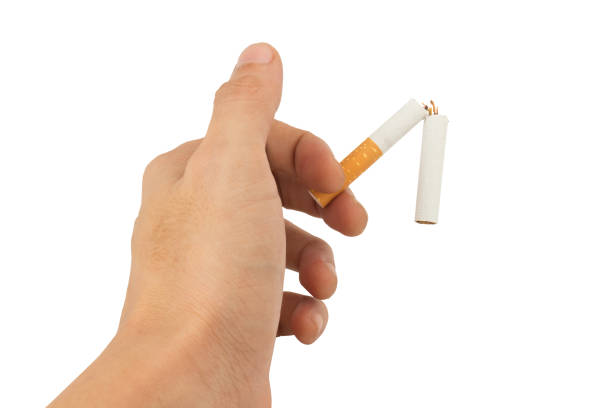 istock cut cigarette hand hold isolated on white background 1032492324