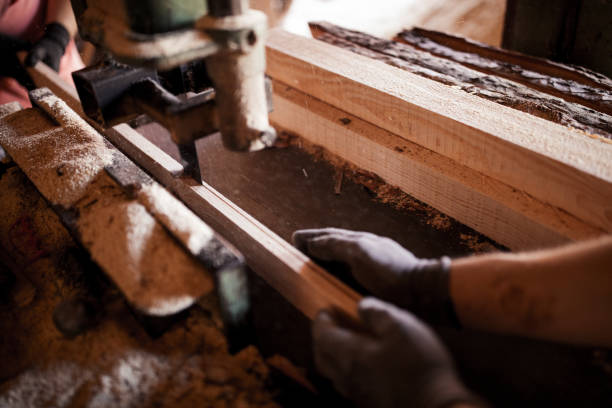 istock Carpenters cutting wooden board 1032492822