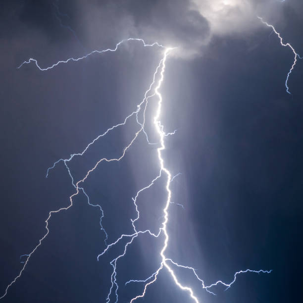 istock lightnings and thunder bold strike at summer storm 1032496004