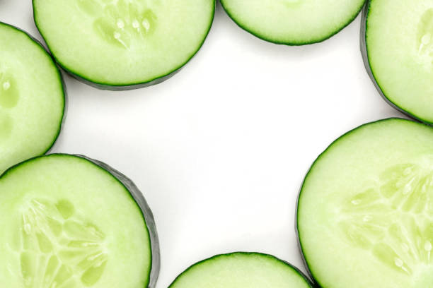 istock Cucumber slices background with a place for text 1032496396