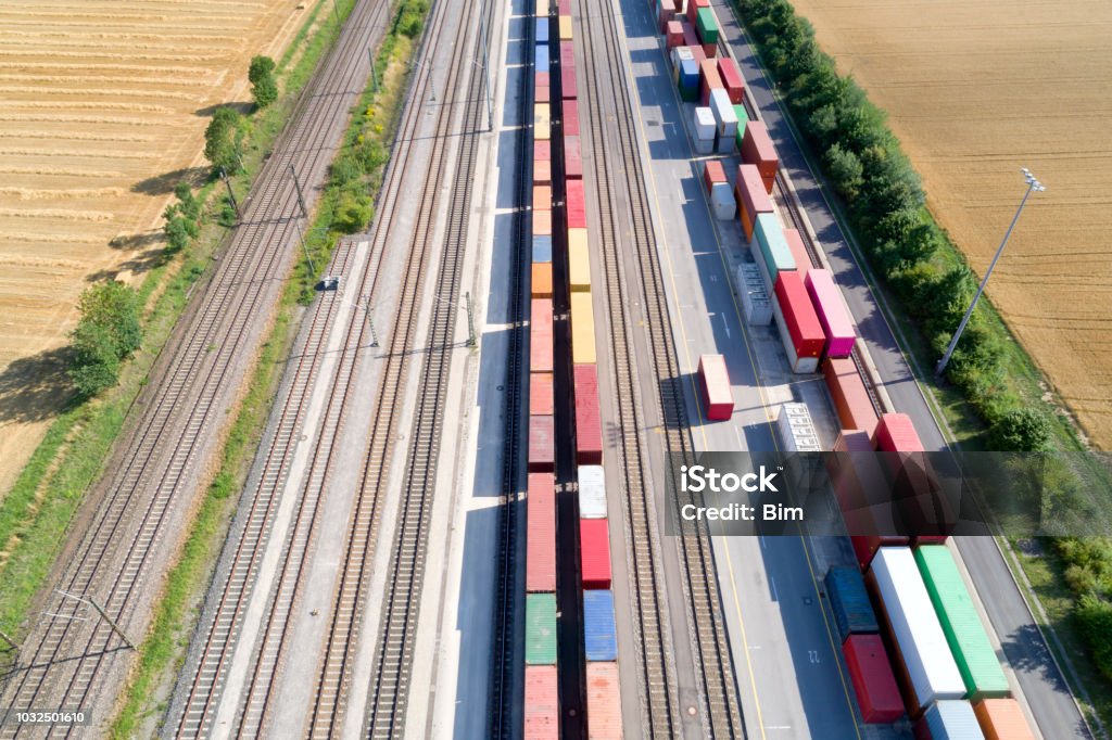 Cargo Containers and Freight Trains, Aerial View Aerial view of cargo containers and freight trains, Baden Wurttemberg, Germany Rail Transportation Stock Photo