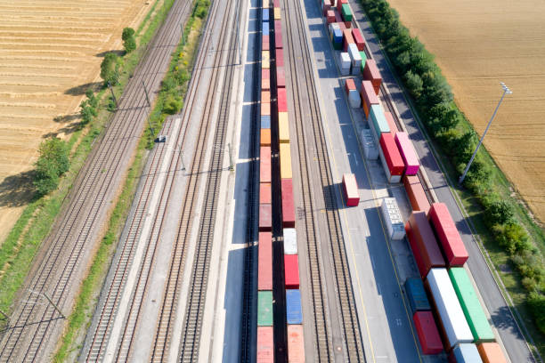 Cargo Containers and Freight Trains, Aerial View Aerial view of cargo containers and freight trains, Baden Wurttemberg, Germany freight train stock pictures, royalty-free photos & images