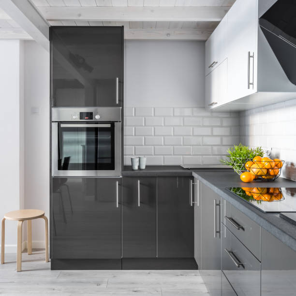 Elegant kitchen interior Elegant kitchen interior with brick tiles and modern cupboards mal stock pictures, royalty-free photos & images