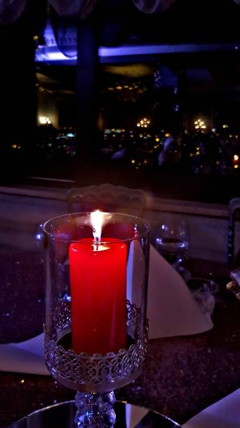 istock Red candle, romantic night, light and candle, candle in glass, elegance 1032507574