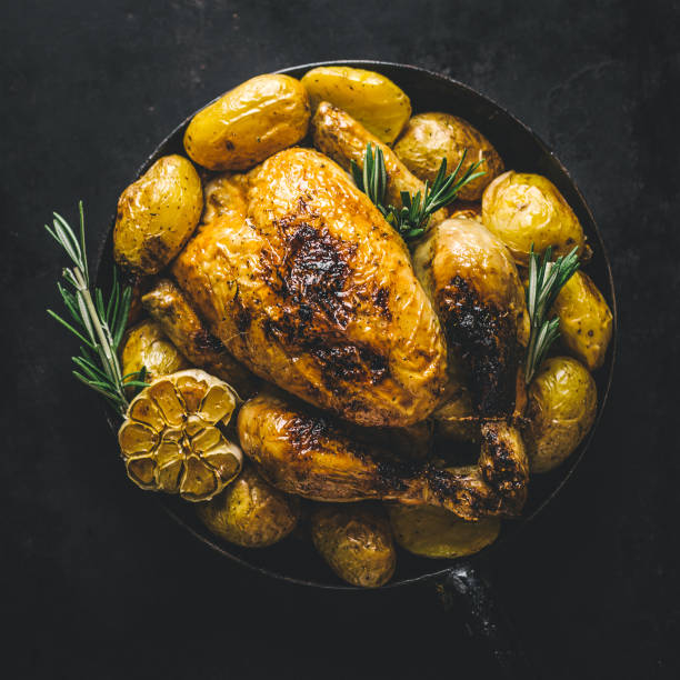 istock Roasted chicken with vegetables in pan 1032508156