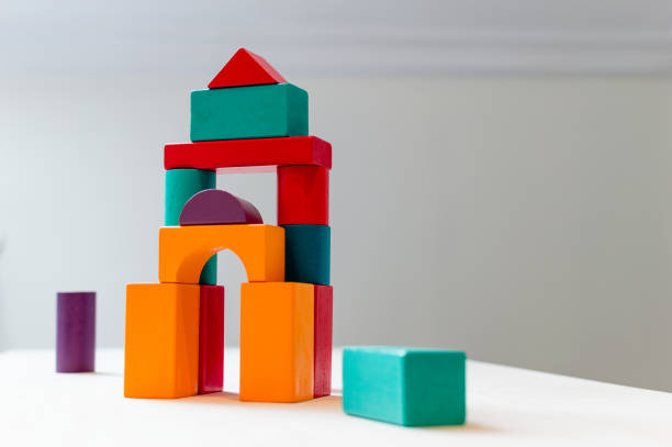 Bright colorful wooden blocks toy. Bricks children building tower, castle, house.