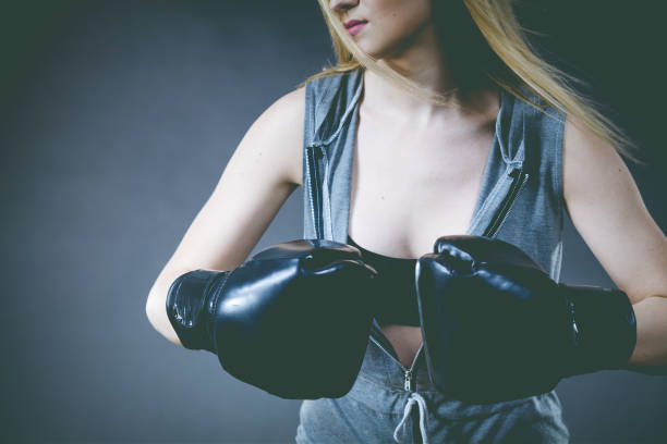 istock Boxer girl exercise with boxing gloves. 1032513564