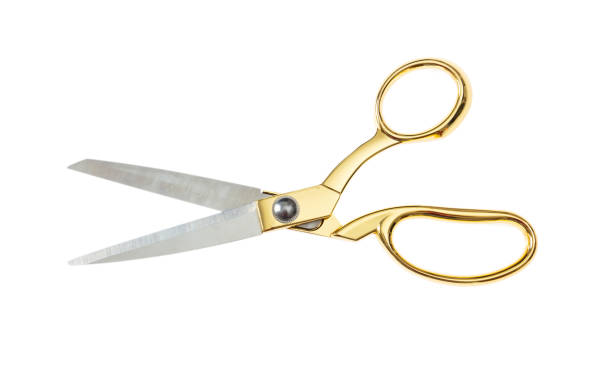 Open pair of scissors isolated on white background, top view Open pair of scissors with golden handle isolated on white background, top view tailor photos stock pictures, royalty-free photos & images