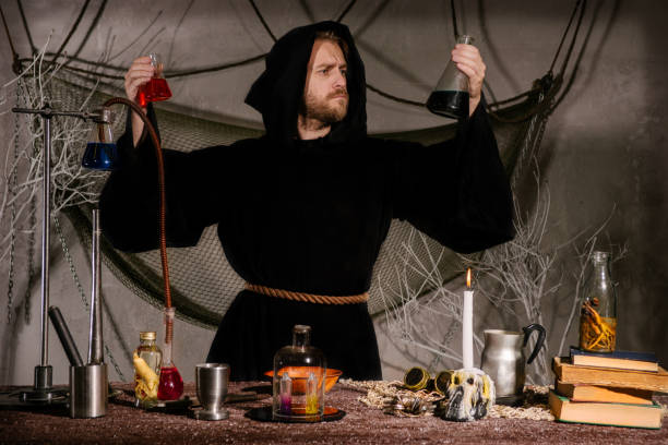 istock medieval alchemist scientist magician looks at the flasks in his laboratory. 1032524706