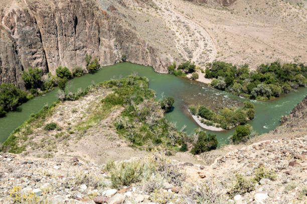 istock Charyn River flows within the Charyn Canyon and provides a fertile shore with its water. The canyon is also called valley of castles and is located east of Almaty in Kazakhstan. 1032532790