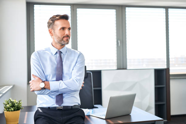 istock CEO, manager standing at modern corporate office 1032535974