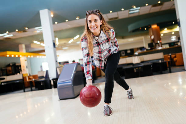 istock Beautiful woman bowling 1032538406