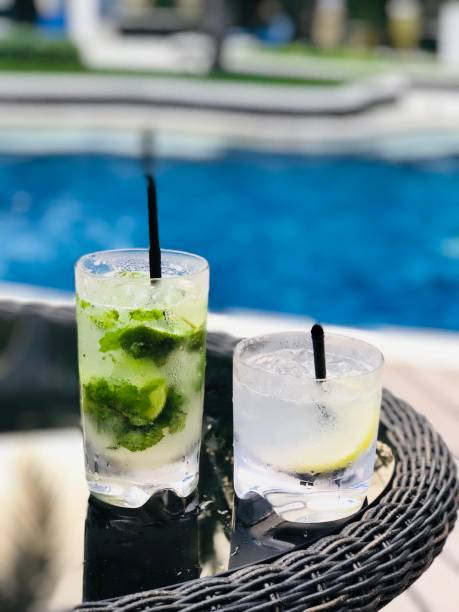 istock pool with mojito annd gin fizz cocktail,luxury setting 1032539216