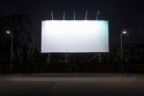 Blank billboard for outdoor advertising poster at night time