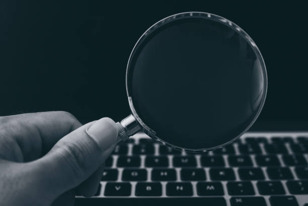 istock Magnifying Glass With Laptop Background 1032544658