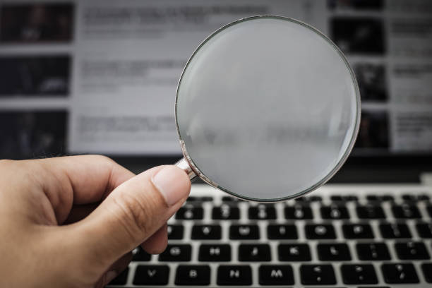 istock Magnifying Glass With Laptop Background 1032544770
