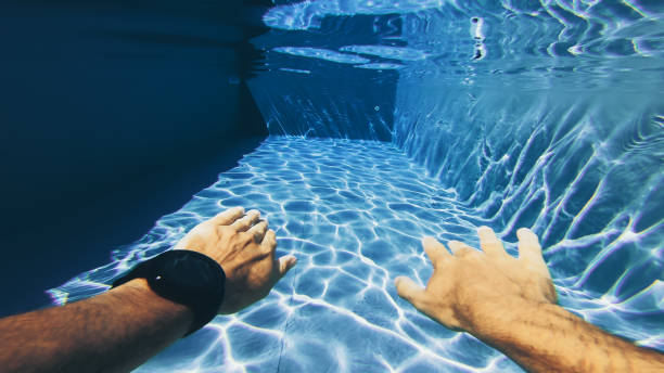 istock Man swimming POV in a swimming pool: summer relax 1032548848