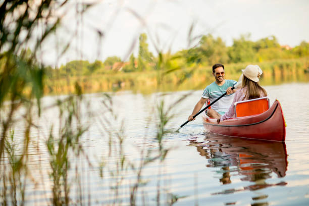 istock Loving couple rowing on the lake 1032551916