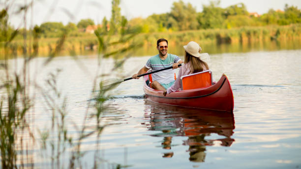 istock Loving couple rowing on the lake 1032551918