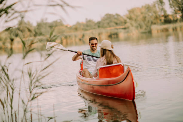 istock Loving couple rowing on the lake 1032551920