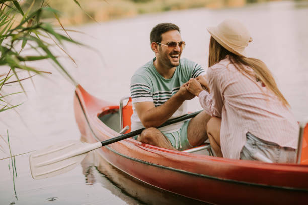 istock Loving couple rowing on the lake 1032551922