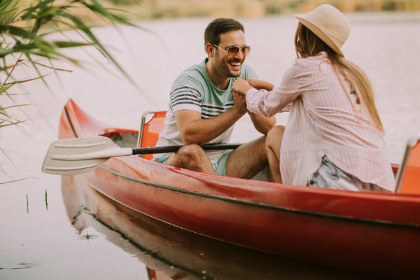 istock Loving couple rowing on the lake 1032551926