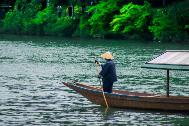 istock Boat man in Arashiyama river Kyoto japan 1032557344