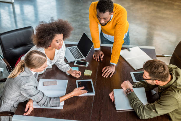istock high angle view of multicultural businesspeople at discussion in office 1032561628