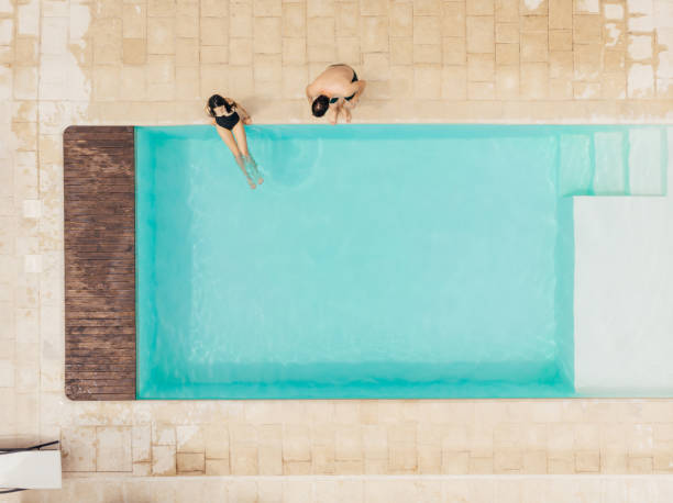 istock top view of couple resting at poolside in Italy 1032572932