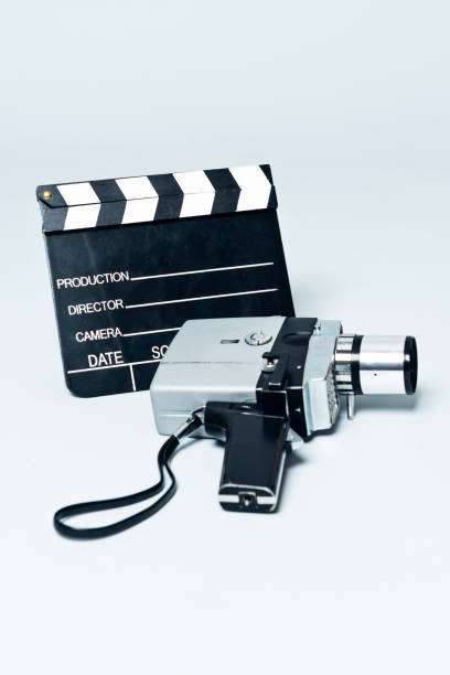 istock Nostalgic moment when child uses retro 8mm video camera 1032578440