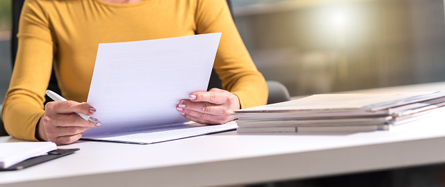 Businesswoman checking document in office