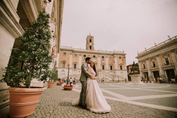 istock Young wedding couple on Capitoline hill in Rome 1032580916