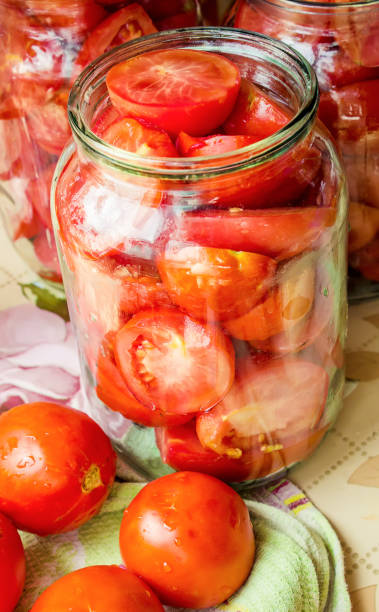 istock Preservation, pickling vegetables of tomatoes and cucumbers. Selective focus. 1032590374