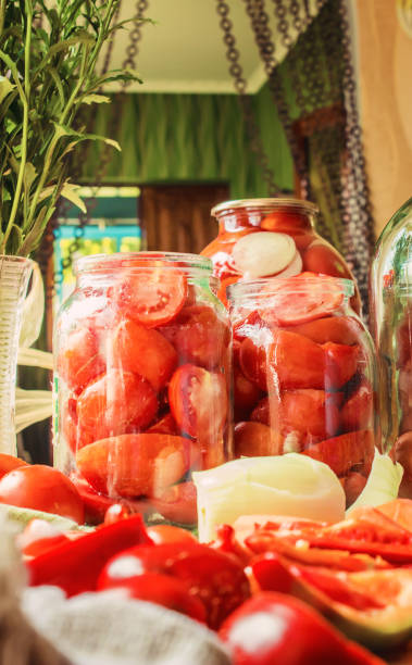 istock Preservation, pickling vegetables of tomatoes and cucumbers. Selective focus. 1032590376