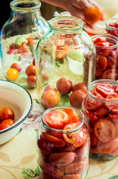 istock Preservation, pickling vegetables of tomatoes and cucumbers. Selective focus. 1032590380