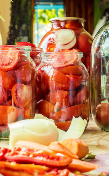istock Preservation, pickling vegetables of tomatoes and cucumbers. Selective focus. 1032590386