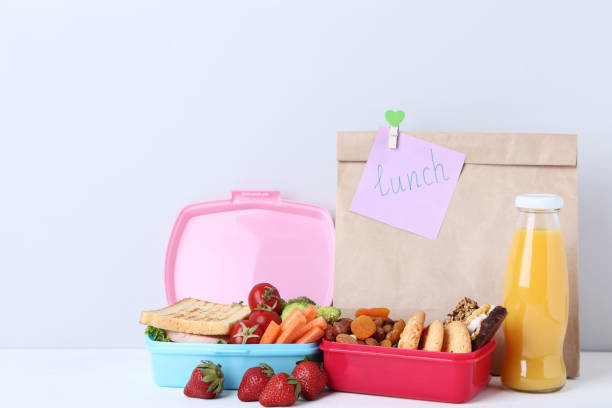 istock School lunch with paper bag on grey background 1032595252