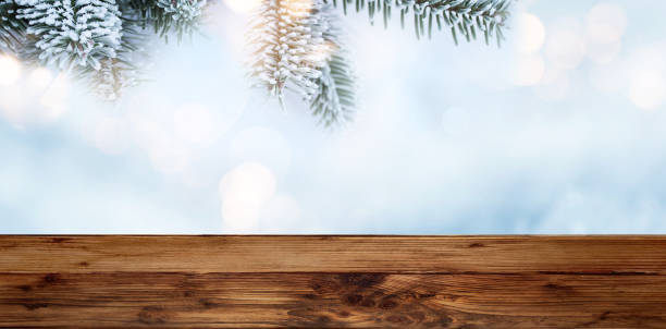 istock Fir branches at christmas time with wooden table 1032595434