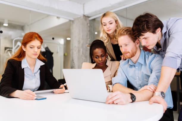 istock Business colleagues sitting at desk 1032596088
