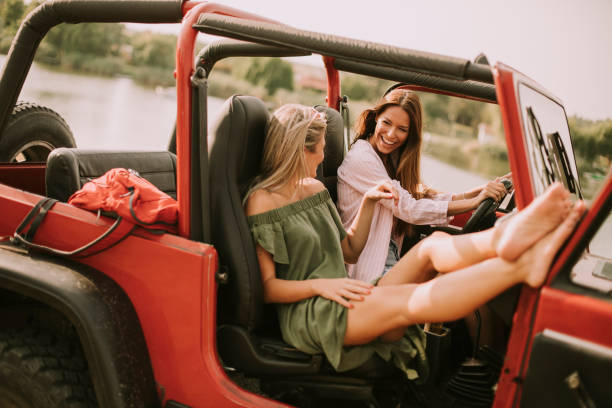 istock Attractive young women in a convertible car 1032605000