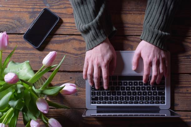 istock Cropped Hands Of Man Using Laptop At Table 1032605714