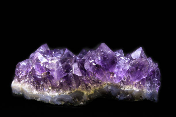 istock Natural Druse of amethyst on a black background front view 1032608332