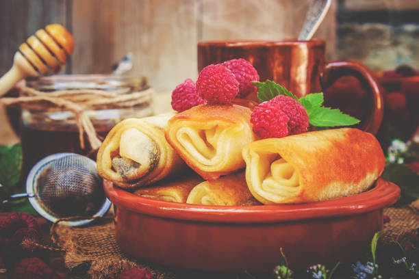 istock Pancakes and tea on a wooden background. Selective focus. 1032609440