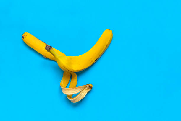 istock banana peel on a blue background, food; fruit 1032609714