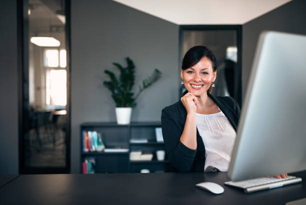 istock Smiling businesswoman at work. 1032612728