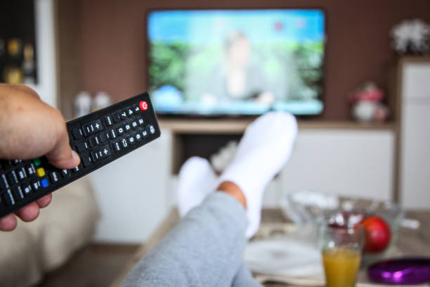istock Looking the tv at home 1032613564