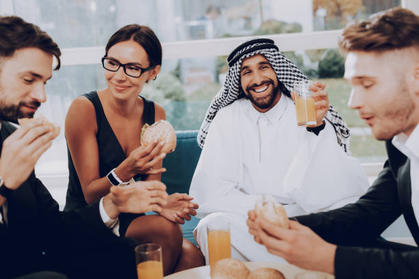 istock Arab Businessman Is Having Dinner With Partners. 1032613784