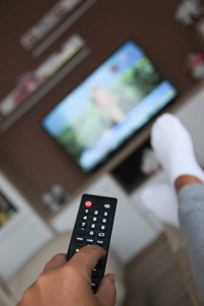 istock Looking the tv at home 1032614572