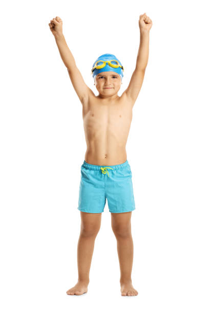 istock Boy wearing swimming trunks holding his hands up 1032614610